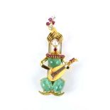 Van Cleef & Arpels, a yellow metal clip in the form a seated musician playing the mandolin,