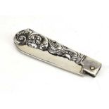 A Dutch metalware repousse decorated pen knife, blade English, maker HH, Sheffield 1883, l. 9.