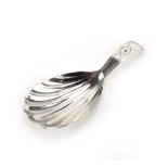 A Georgian silver old English pattern caddy spoon with shell bowl and wrigglework handle,