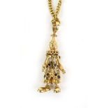 A 9ct yellow gold articulated pendant in the form of a clown set small diamonds,