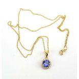 An 18ct yellow gold fine flat curblink necklace suspending an 18ct yellow gold cluster pendant set