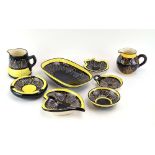 Eight items of Quimper 'lace' pottery decorated in shades of black and yellow (8)