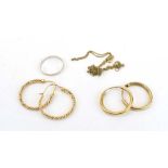 A mixed parcel of 9ct gold and yellow metal jewellery comprising two pairs of hoop earrings,