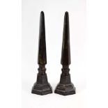 A pair of early 20th century marbled spelter obelisks, h.