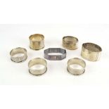 A set of three silver engine turned napkin rings, maker HG&S,