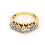 An 18ct yellow gold ring set three rows of twenty-two small diamonds in a slightly raised setting,