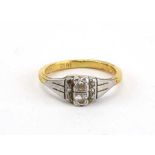 An 18ct yellow gold ring set two diamonds and six smaller diamonds in an illusion setting,