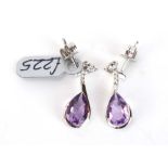 A pair of 9ct white gold ear pendants, each set a three small diamonds and teardrop amethyst, l. 2.