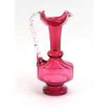 A cranberry glass water jug, h. 25.