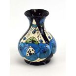 A Moorcroft vase of slender ovoid form decorated in the 'Rennie Rose' pattern, h. 15.