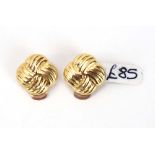 A pair of yellow metal ear clips of knot design, w. 1.2 cm, 2.