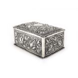 A Victorian silver hinged box of rectangular form, repousse decorated in the Rococo manner,