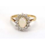 A 9ct yellow gold dress ring set oval and paste cluster, ring size T, 2.