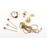 A mixed parcel of yellow metal jewellery including an 18ct yellow gold charm in the form of a clock,