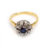 An 18ct yellow gold and platinum highlighted cluster ring set circular sapphire within a tiered