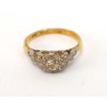 An 18ct yellow gold and platinum highlighted ring set old cut diamond in an illusion setting,
