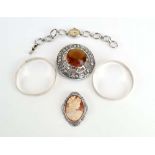 A pair of Hungarian silver bangles, a Scottish metalware brooch of typical form,