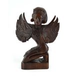 A Far Eastern hardwood carving modelled as winged female, h.