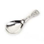 A Victorian silver fiddle pattern caddy spoon with florally engraved handle, George Unite,