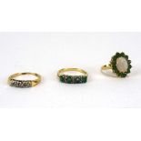 A 14ct yellow gold ring set four small diamonds,