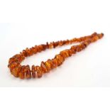 An amber-type graduated bead necklace, l.