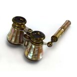 A pair of early 20th century mother-of-pearl and brass opera glasses,