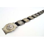 An Edwardian silver eighteen section belt,