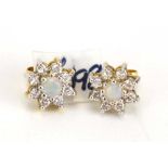 A pair of 18ct yellow gold ear studs, each set an opal and diamond cluster, d. 8 mm, 2.