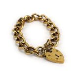 A 9ct yellow gold curblink bracelet with heart shaped padlock clasp, 38.