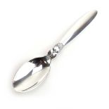 A silver preserves spoon decorated with stylised flowerheads, Georg Jensen, l.