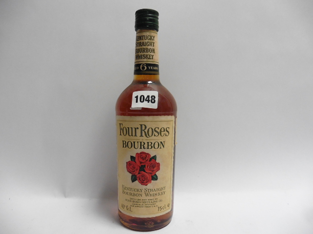 An old bottle of Four Roses Kentucky Straight Bourbon Whiskey aged 6 years 43% 75cl