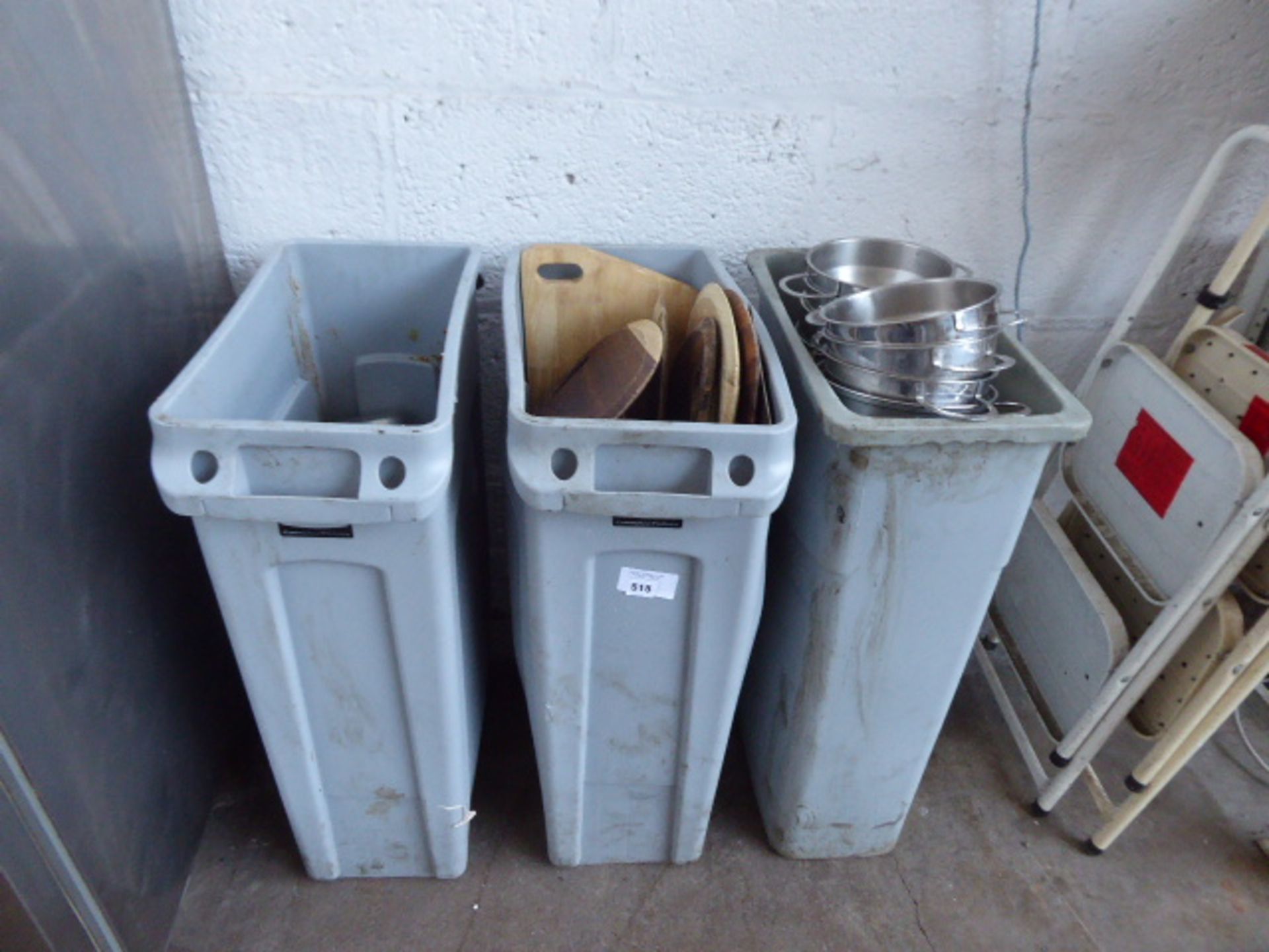 3 Rubbermaid tubs containing wooden serving platters, balti type dishes and small stainless steel