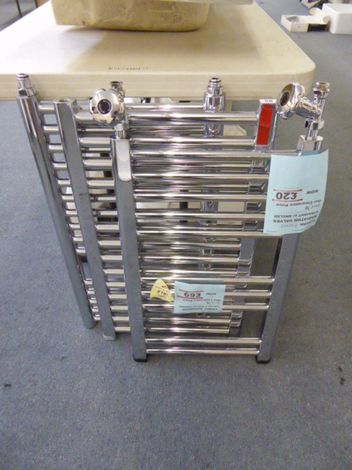 Three chromium heated towel rails