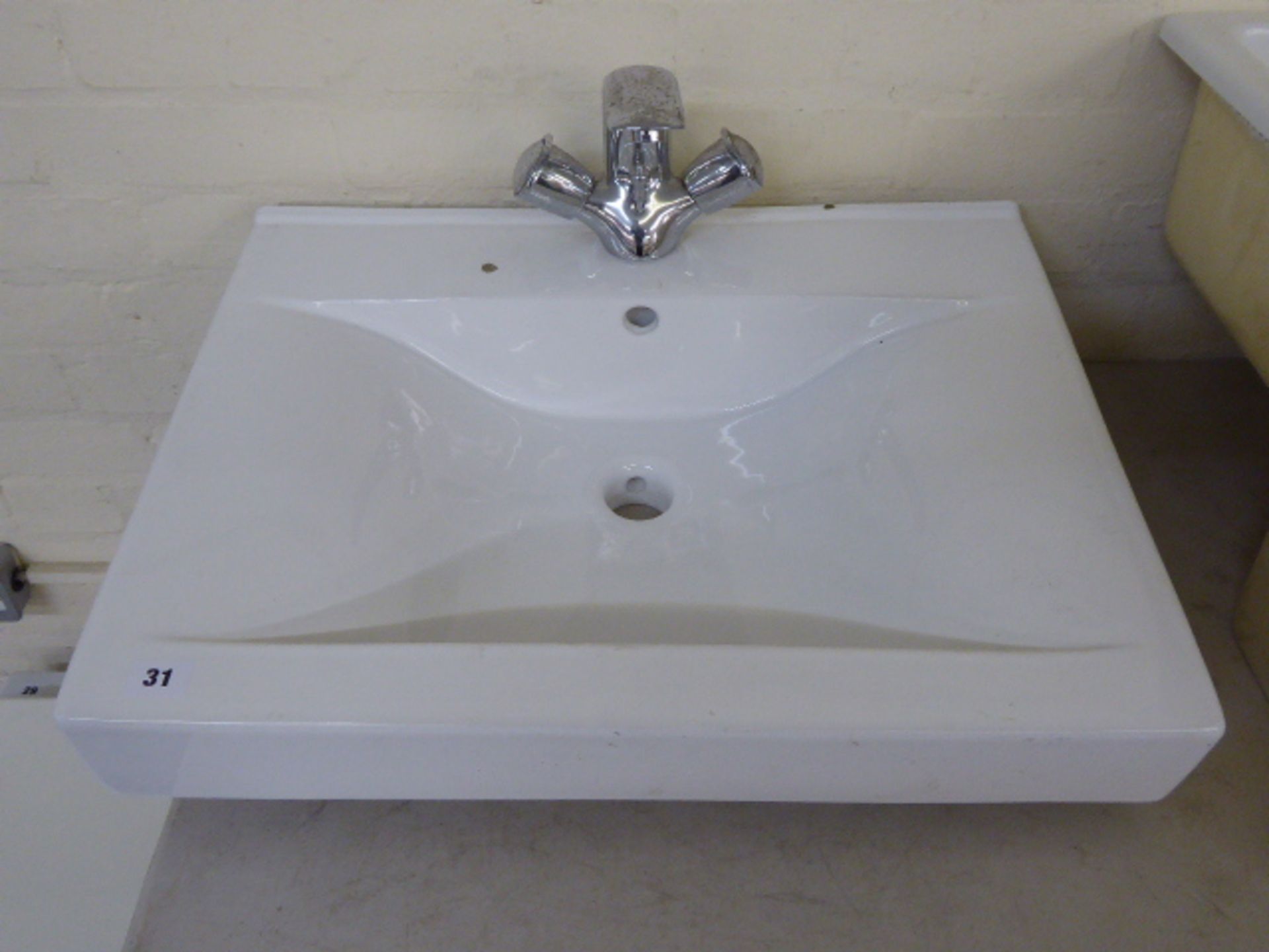 Rectangular wash basin with mixer taps