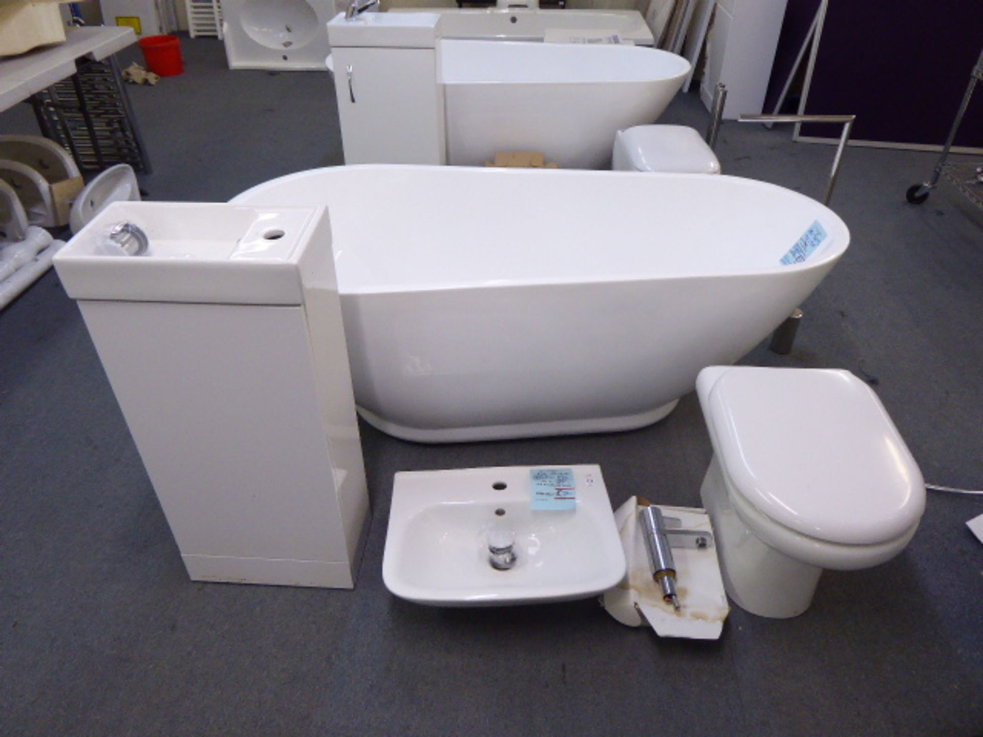 A Pacific white acrylic double skinned freestanding bath with upstand and waterfall tap, wash basin,