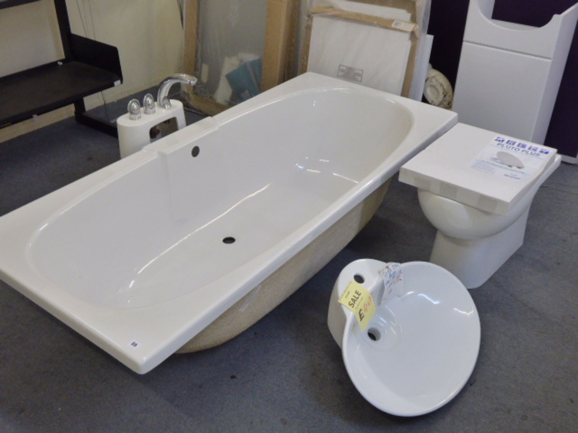 A rectangular acrylic sink with pedestal with mixer tap, toilet, soft close seat, wash basin, vanity