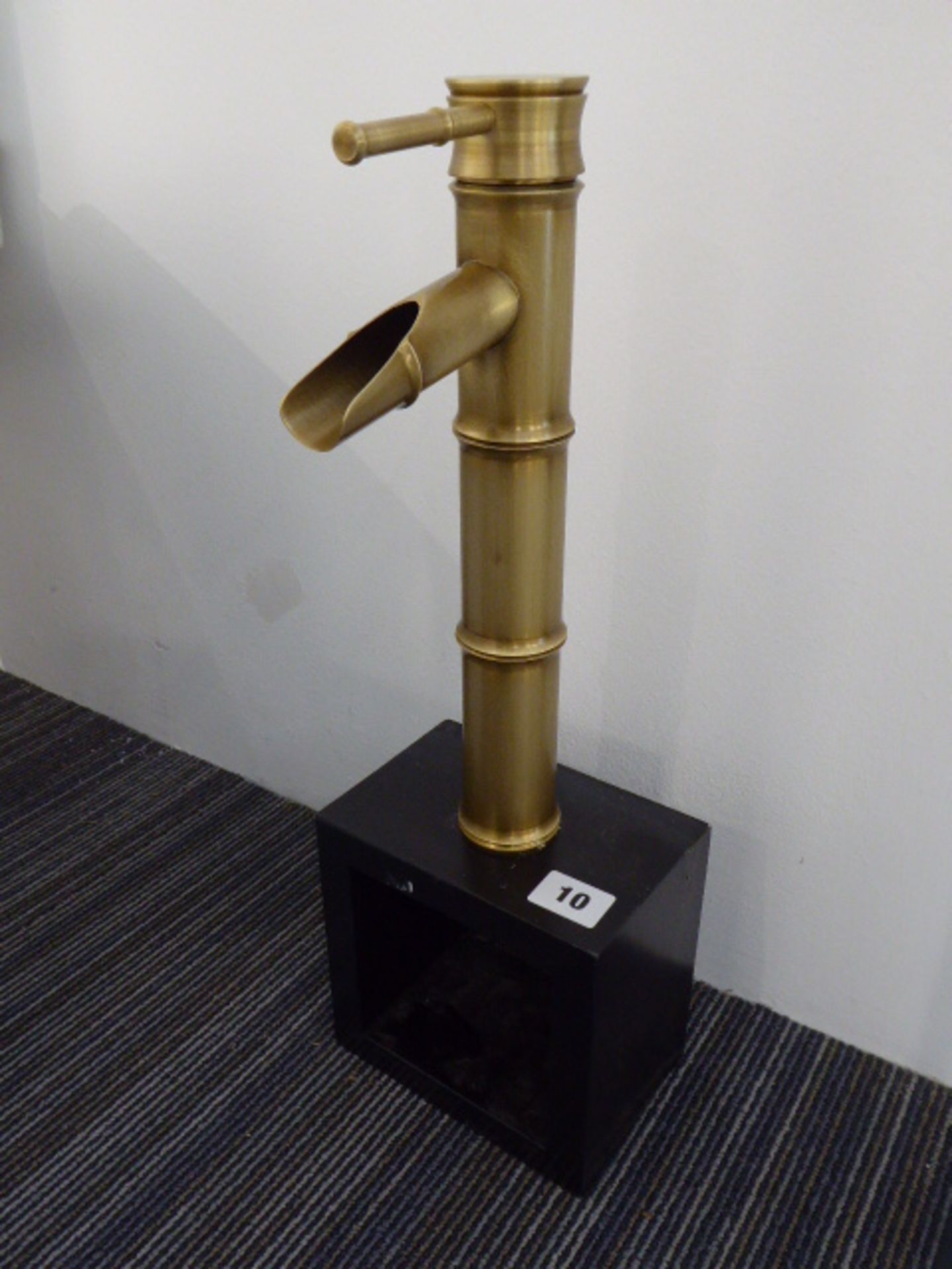 Unusual brass effect single lever waterfall tap