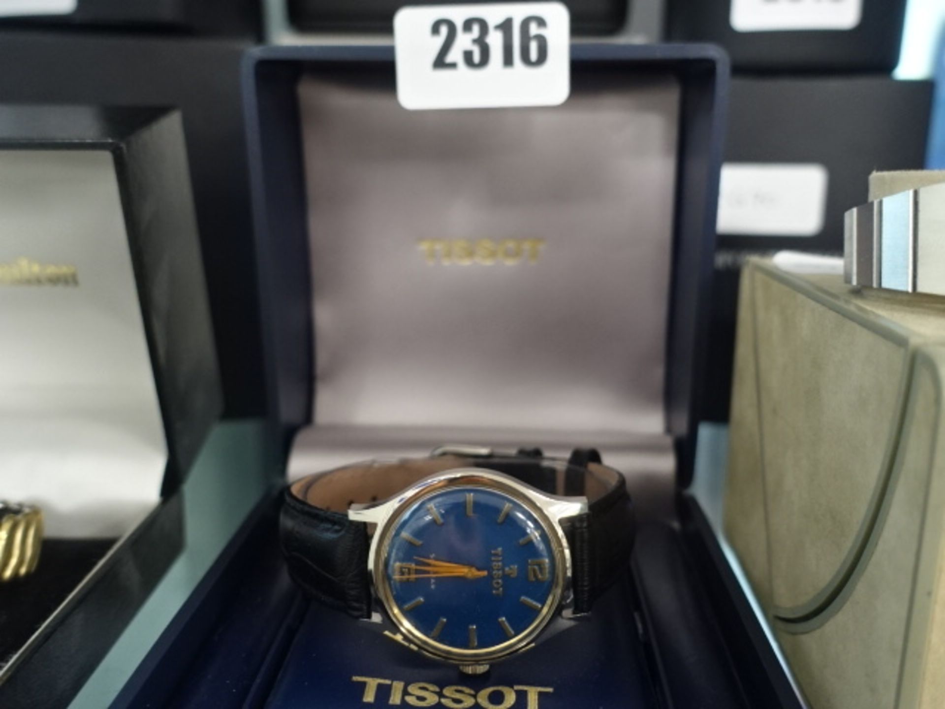 Tissot gents wristwatch with blue face and black leather strap in box