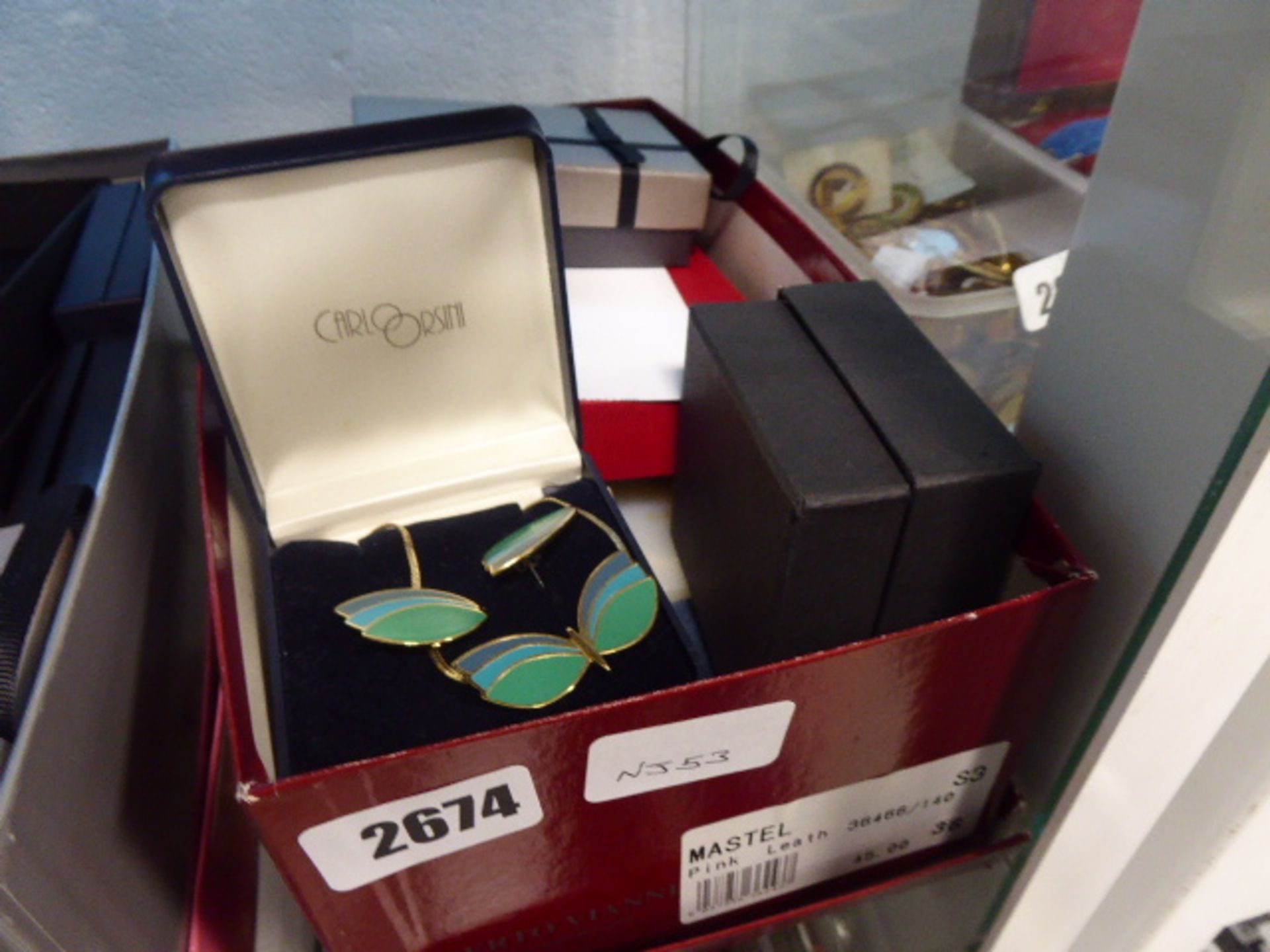 Box containing costume jewellery earring and necklace sets