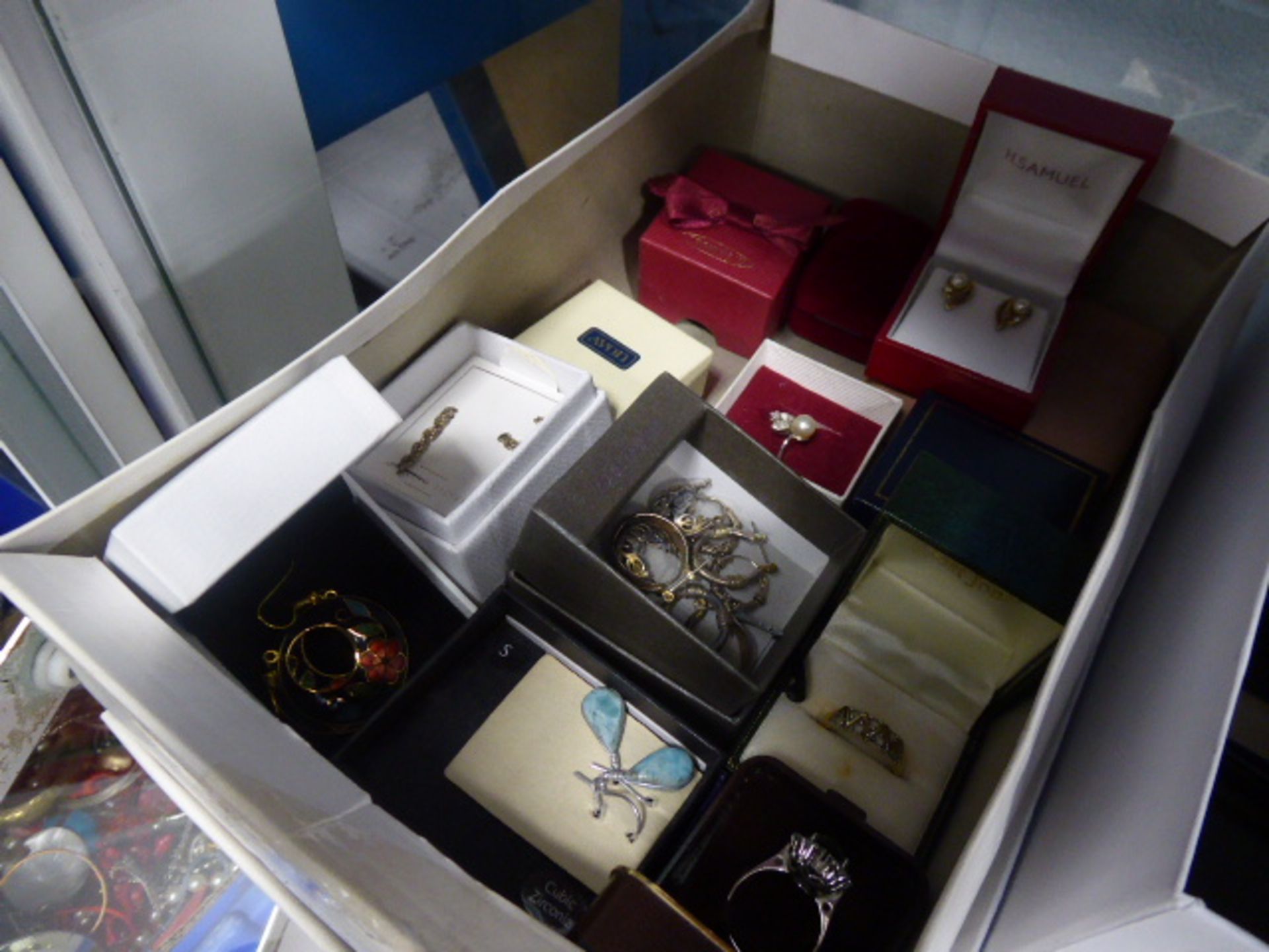 Box containing quantity of various earrings