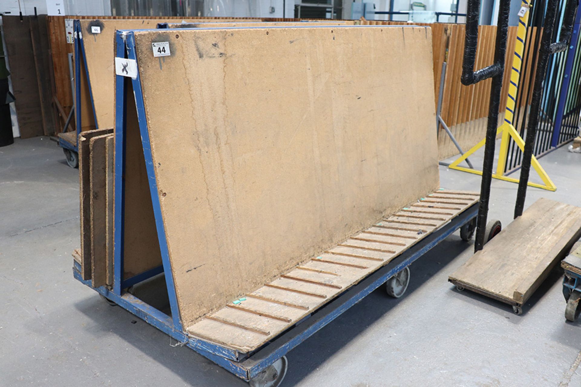 Welded steel and chipboard double sided stock trolley (approx 2 metres long x 1 metre high)