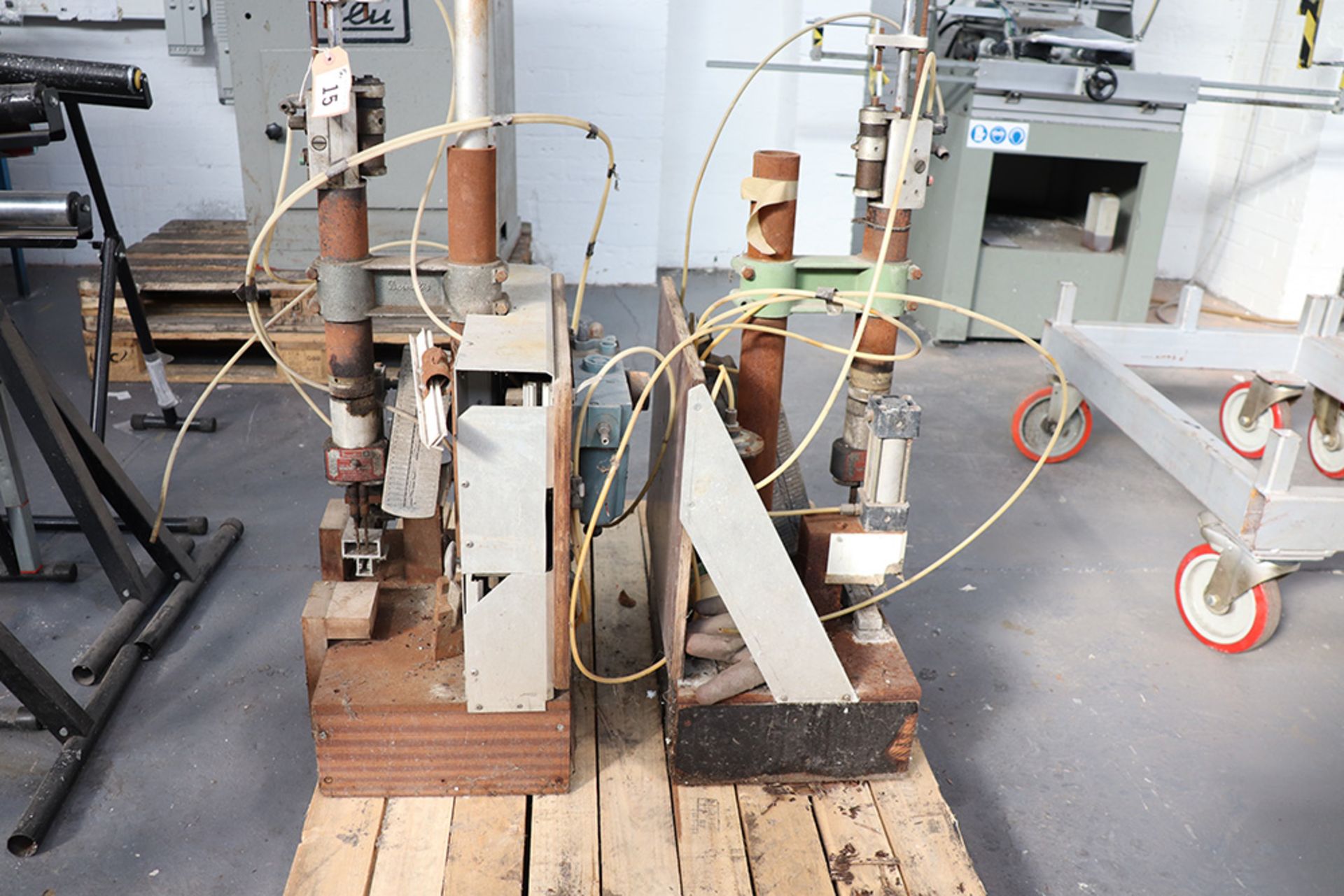 Two air operated Desoutter twin headed drills with treadle operation