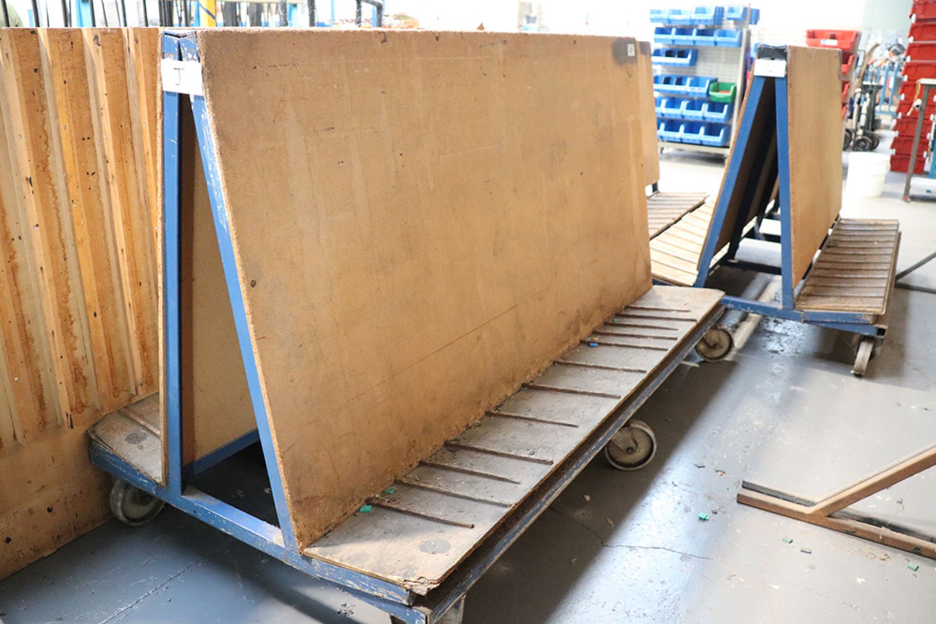 Welded steel and chipboard double sided stock trolley (approx 2 metres long x 1 metre high)