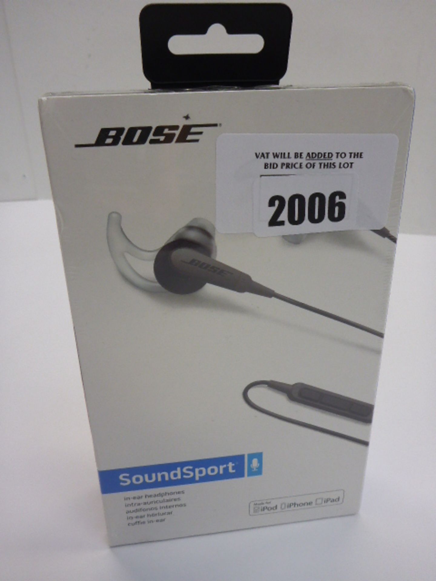 Bose soundsport in-ear headphones in sealed box.