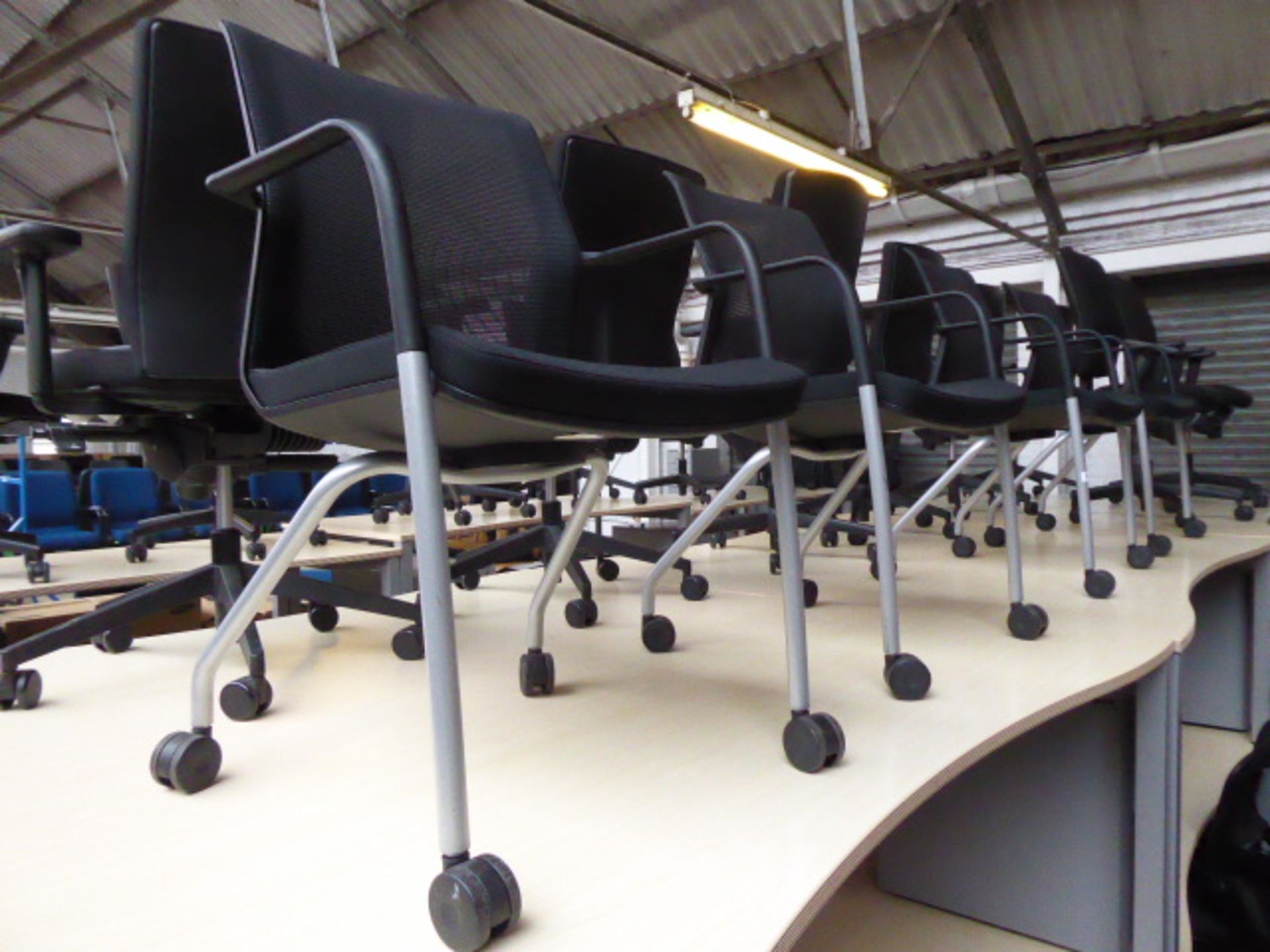 4 Orangebox black cloth and mesh mobile chairs on tubular legs