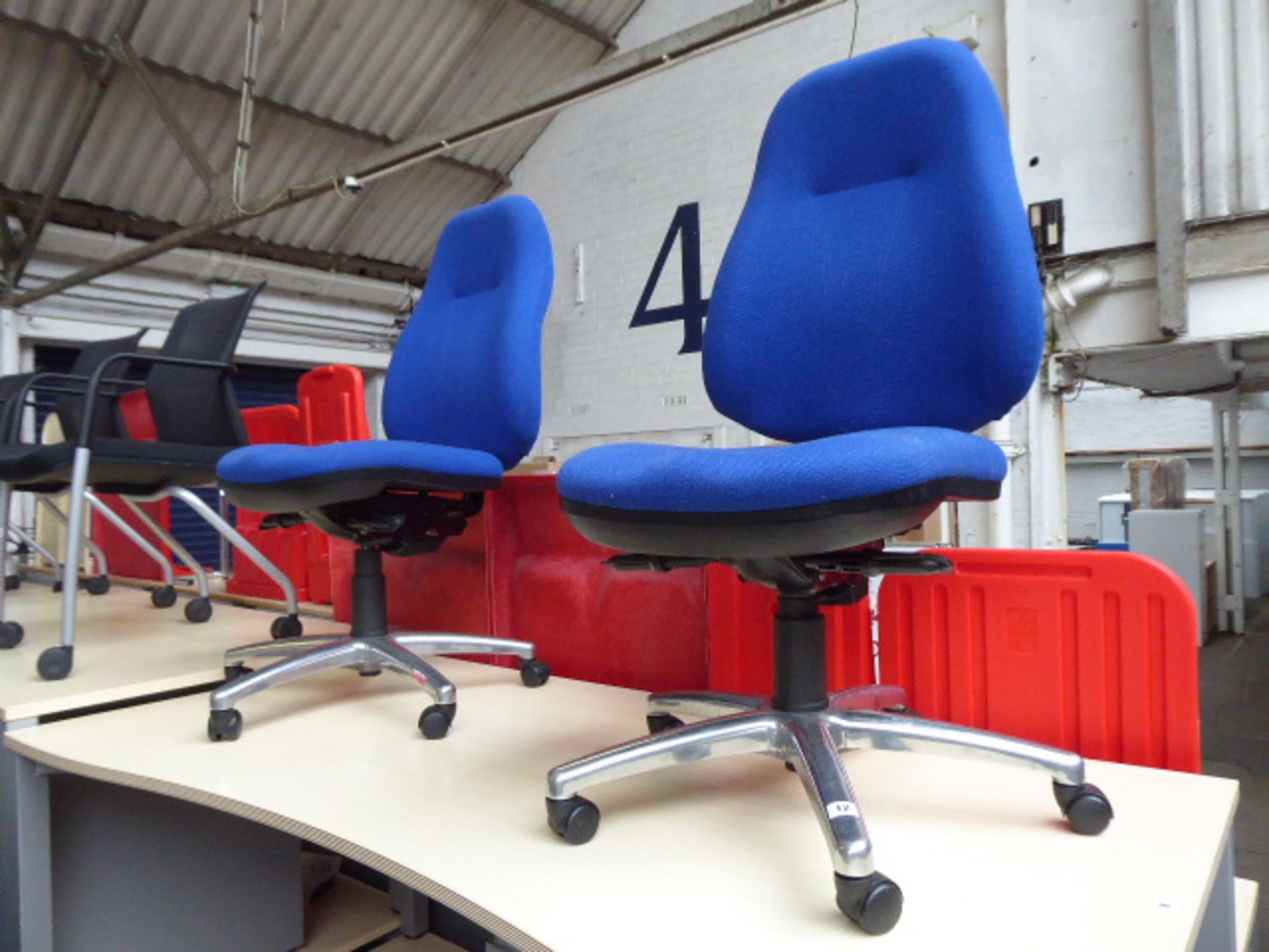 2 blue cloth high back swivel chairs