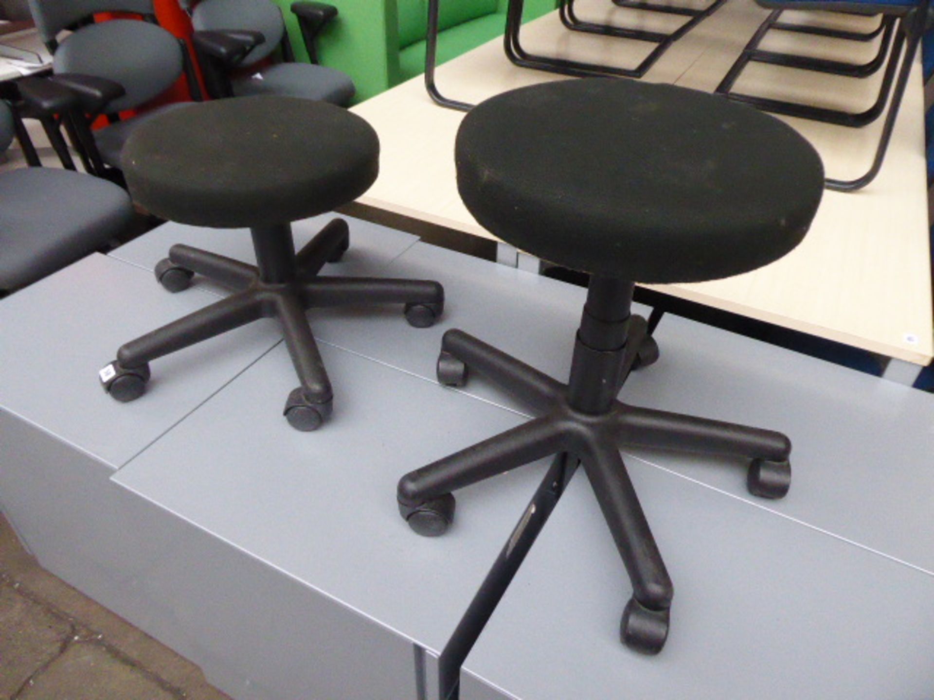 2 black cloth low stools