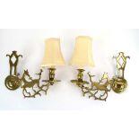 A pair of brass figural wall sconces modelled as prancing horses