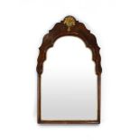 A 19th century walnut framed wall mirror of arched form with gilt decorated shell motif, h.