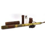 A Dolland of London four-drawer brass and mahogany telescope, with a leather case,